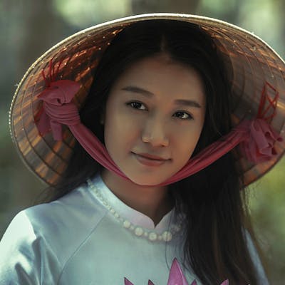 a picture of a woman, cropped to focus on her face"alt="a picture of a woman, cropped to a square